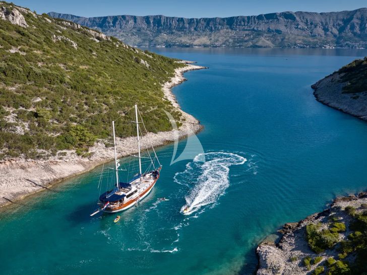LOTUS Gulet 30m - anchored near an island LOTUS Gulet 30m - anchored near an island