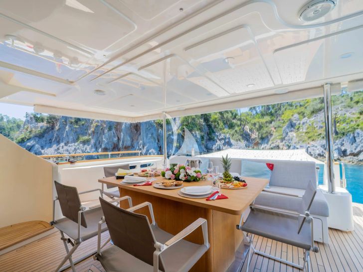 MILENA Custom Line Navetta 28 - main aft deck alfresco dining set up MILENA Custom Line Navetta 28 - main aft deck alfresco dining set up