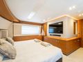 MILENA Custom Line Navetta 28 - master cabin bed and TV MILENA Custom Line Navetta 28 - master cabin bed and TV