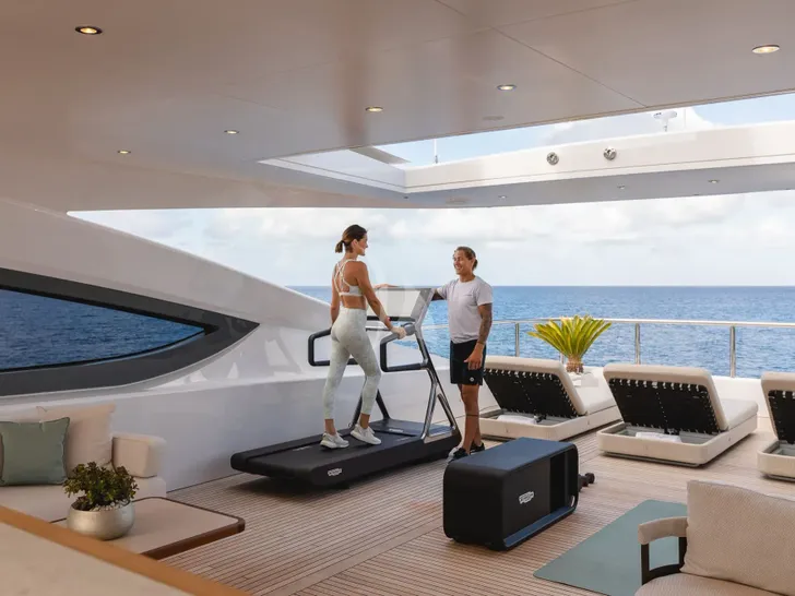 MINE GAMES Benetti B.Now 50 - guests using the sun deck gym MINE GAMES Benetti B.Now 50 - guests using the sun deck gym