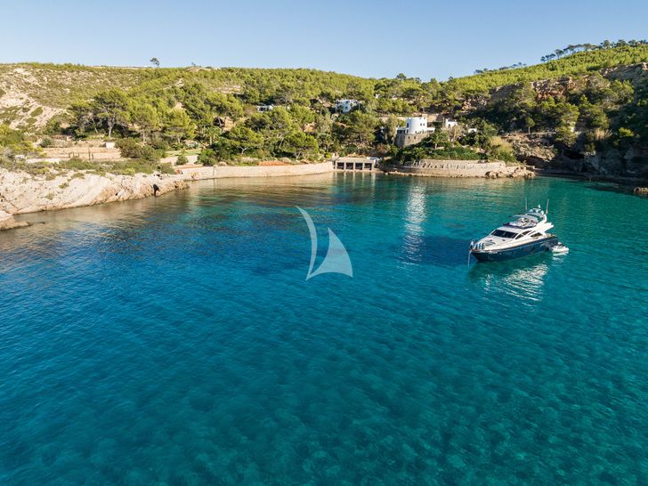 MR CORN Azimut 78 anchored near an island