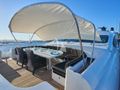 MRS GREY Mangusta 130 foredeck dining and lounging area