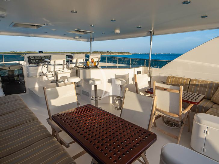 NEXT CHAPTER Hargrave 97 RPH - flybridge lounge and dining area NEXT CHAPTER Hargrave 97 RPH - flybridge lounge and dining area