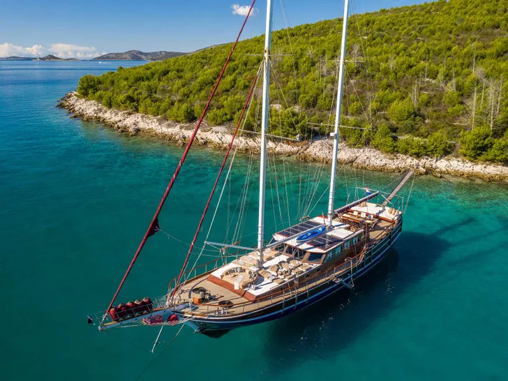 GULET NOSTRA VITA Custom 32m - anchored near an island GULET NOSTRA VITA Custom 32m - anchored near an island
