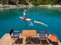 NO STRESS 888 Riva Corsaro 100 - swim platform and guests using water toys NO STRESS 888 Riva Corsaro 100 - swim platform and guests using water toys