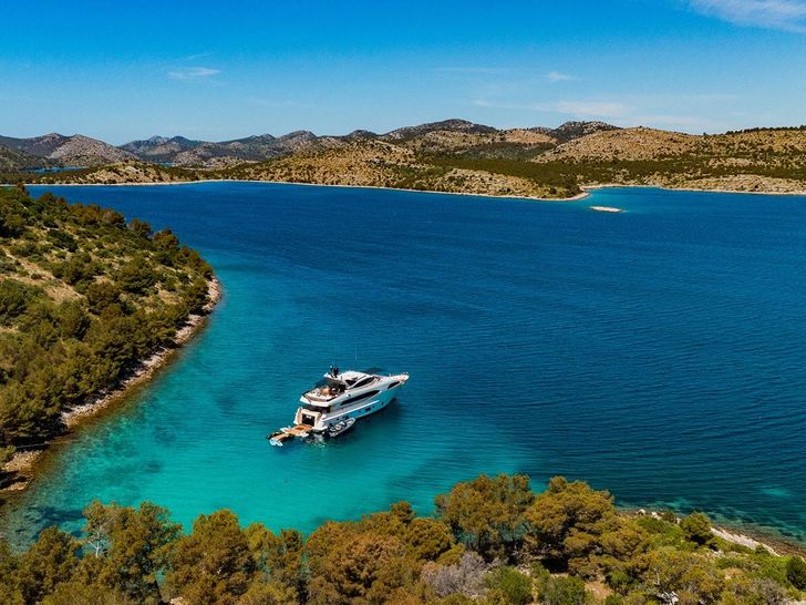 NOVELA CBI Navi Custom 30m - anchored near an island NOVELA CBI Navi Custom 30m - anchored near an island