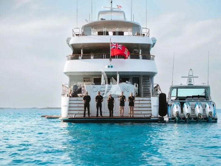 OCEAN CLUB Trinity Yachts 164 - aft shot with the crew OCEAN CLUB Trinity Yachts 164 - aft shot with the crew