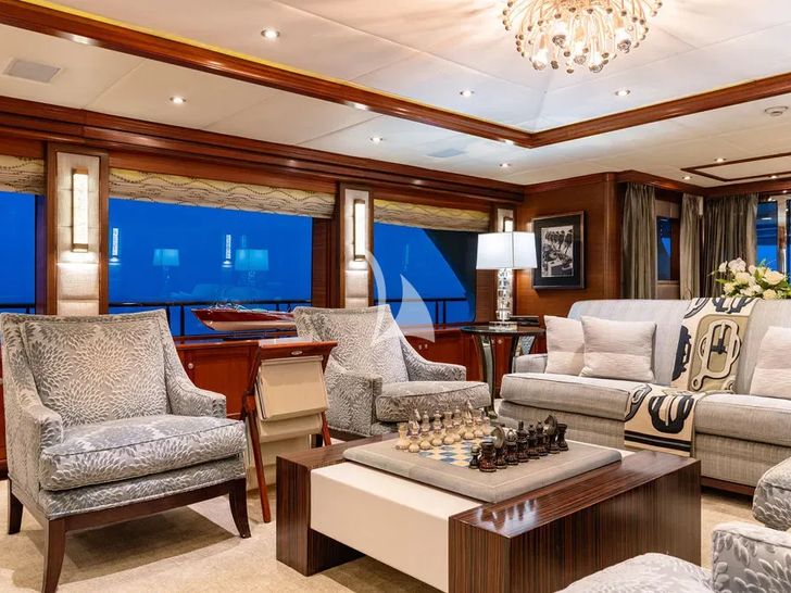 OCEAN CLUB Trinity Yachts 164 - main saloon seating with a chess board OCEAN CLUB Trinity Yachts 164 - main saloon seating with a chess board