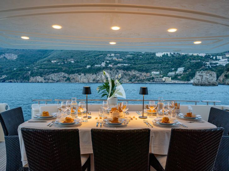 PAMPERO Ferretti 760 - aft deck dining area PAMPERO Ferretti 760 - aft deck dining area