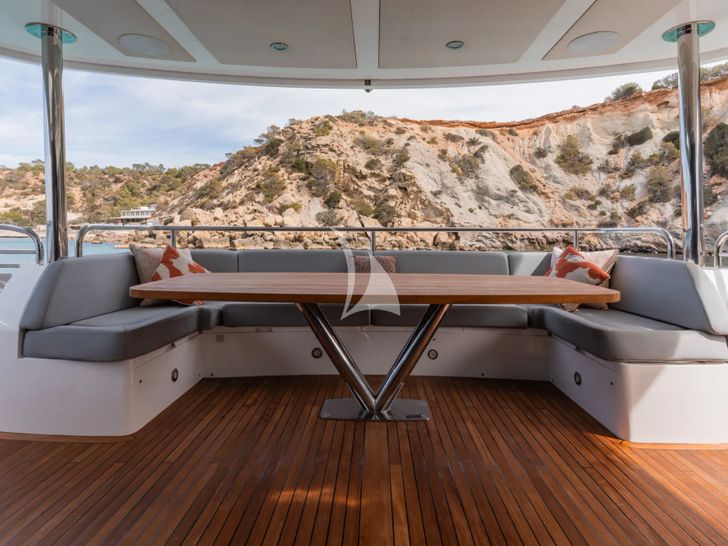 PLAY THE GAME Sunseeker 28m - aft deck seating and dining area PLAY THE GAME Sunseeker 28m - aft deck seating and dining area