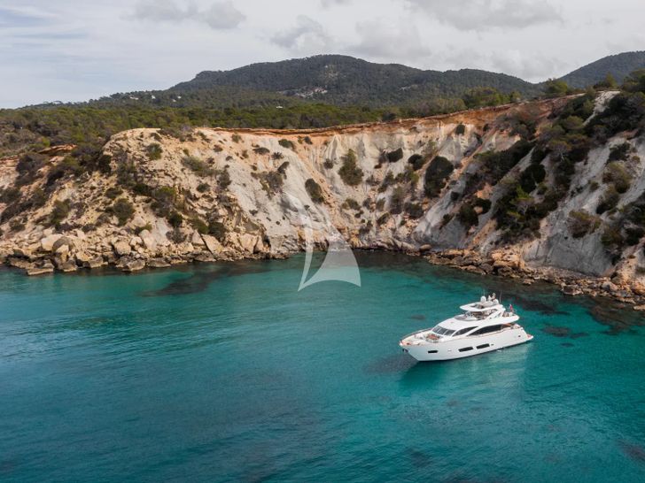 PLAY THE GAME Sunseeker 28m - anchored near an island PLAY THE GAME Sunseeker 28m - anchored near an island