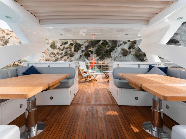 PLAY THE GAME Sunseeker 28m - flybridge seating and dining area PLAY THE GAME Sunseeker 28m - flybridge seating and dining area