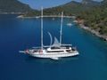 QUEEN OF MAKRI Custom Sailing Yacht 40m - anchored near an island QUEEN OF MAKRI Custom Sailing Yacht 40m - anchored near an island