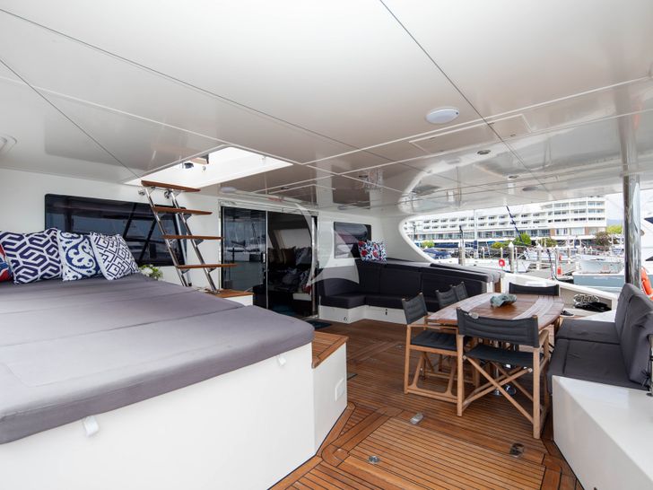 S/Y FENG Sunreef 70 - aft deck sunbathing area and dining lounge S/Y FENG Sunreef 70 - aft deck sunbathing area and dining lounge