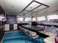 S/Y FENG Sunreef 70 - saloon seating and dining with TV S/Y FENG Sunreef 70 - saloon seating and dining with TV