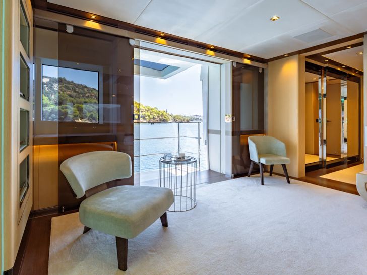 SANCTUARY Mangusta Oceano 43 - master cabin seating and balcony SANCTUARY Mangusta Oceano 43 - master cabin seating and balcony