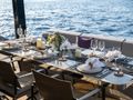 SEA BLISS Sunreef 70 - alfresco dining set up SEA BLISS Sunreef 70 - alfresco dining set up