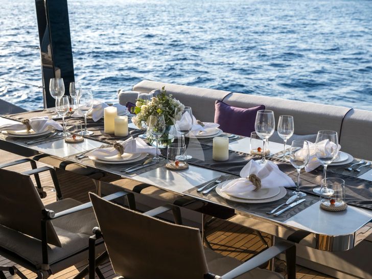 SEA BLISS Sunreef 70 - alfresco dining set up SEA BLISS Sunreef 70 - alfresco dining set up