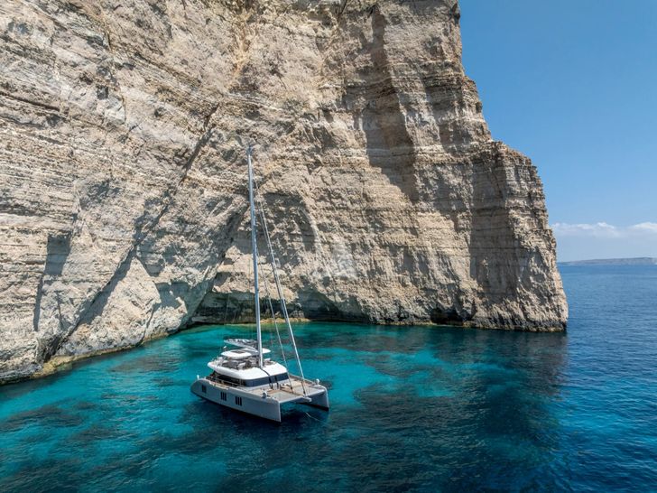 SEA BLISS Sunreef 70 - anchored by the cliff SEA BLISS Sunreef 70 - anchored by the cliff