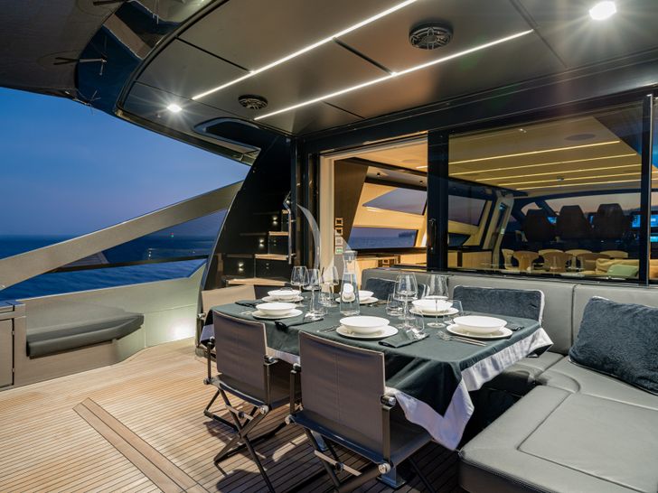 SOPHIA Pershing 9X aft deck dinner set up