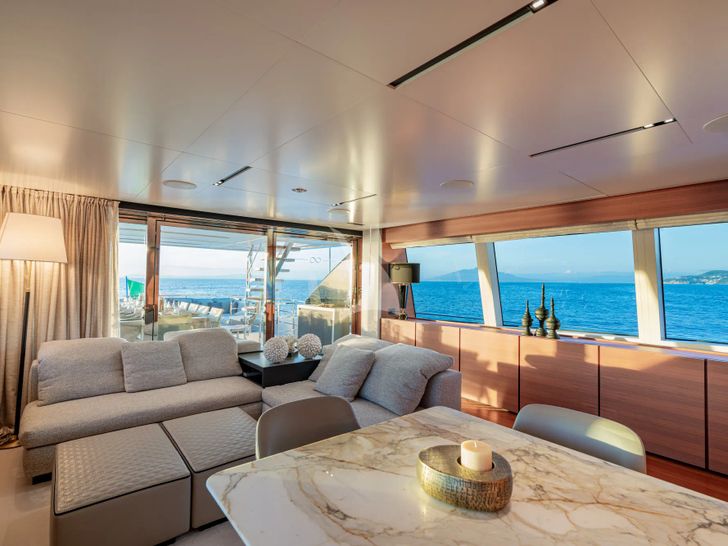 SOUTH Ferretti Custom Line Navetta 33 - sky lounge seating and dining area SOUTH Ferretti Custom Line Navetta 33 - sky lounge seating and dining area