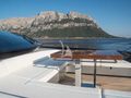 SPACE COWBOY Riva 88 Folgore - foredeck lounge and dining area SPACE COWBOY Riva 88 Folgore - foredeck lounge and dining area