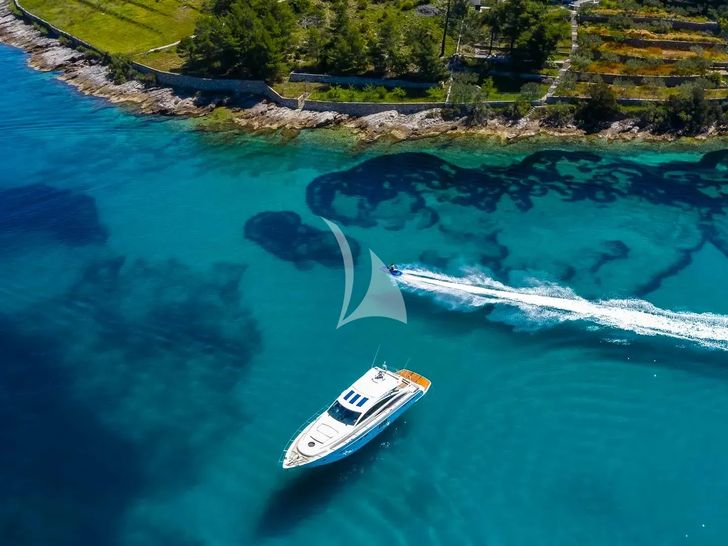 SPICE OF LIFE II Princess V65 - anchored near an island SPICE OF LIFE II Princess V65 - anchored near an island