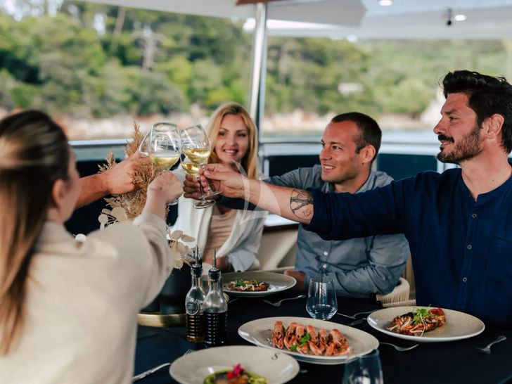 SYMPHONY Custom Yacht 52m - guests dining alfresco SYMPHONY Custom Yacht 52m - guests dining alfresco