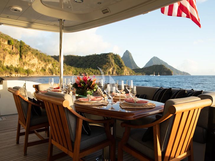 TEMPTATION Palmer Johnson 123 - aft deck alfresco dining set up TEMPTATION Palmer Johnson 123 - aft deck alfresco dining set up