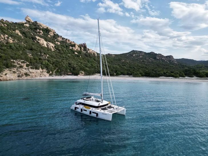 THE SUN Lagoon 620 - anchored near an island THE SUN Lagoon 620 - anchored near an island