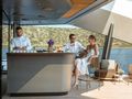 THIS IS IT Tecnomar Radical 43 m - guests enjoying the foredeck bar THIS IS IT Tecnomar Radical 43 m - guests enjoying the foredeck bar