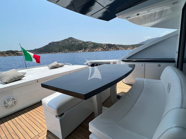THYKE II Pershing 80 foredeck lounging and dining area