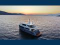 UKIEL Aegean Explorer M26 anchored under the sunset