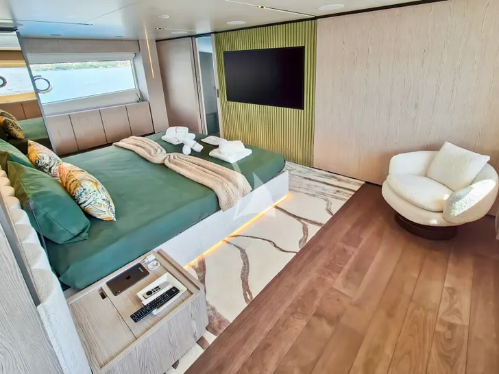 UPSTREAM Ferretti Custom Line Navetta 33 - master cabin bed and TV UPSTREAM Ferretti Custom Line Navetta 33 - master cabin bed and TV