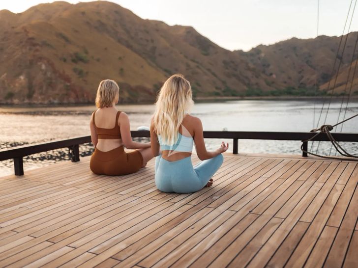 VELA Phinisi 50m - sundeck yoga session VELA Phinisi 50m - sundeck yoga session