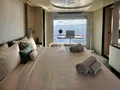 VOLANTE Azimut Grande 32M - master cabin bed and vanity area VOLANTE Azimut Grande 32M - master cabin bed and vanity area