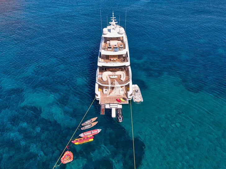 VOLO MARE Azimut Grande Trideck 38m - anchored aft shot with the water toys VOLO MARE Azimut Grande Trideck 38m - anchored aft shot with the water toys