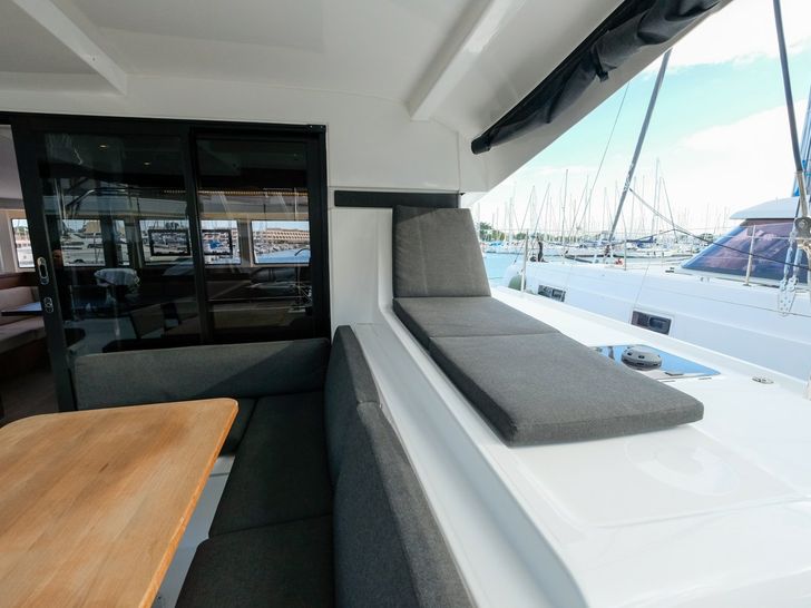 WHITE CHADAL Lagoon 42 - aft deck dining table and sunpad WHITE CHADAL Lagoon 42 - aft deck dining table and sunpad