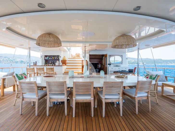 YAZZ Aegean Custom Sailing Yacht 55m - aft alfresco dining area YAZZ Aegean Custom Sailing Yacht 55m - aft alfresco dining area