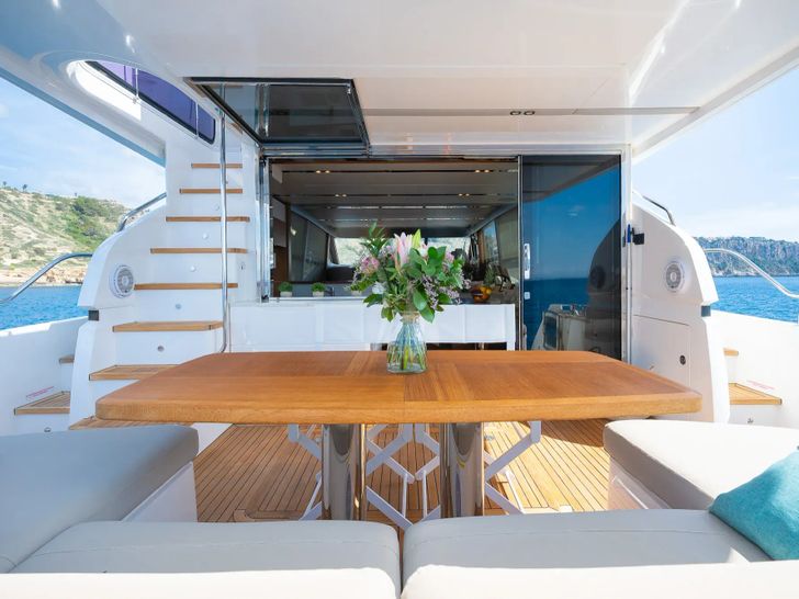 ZEN OF LONDON Princess 68 - aft deck dining table ZEN OF LONDON Princess 68 - aft deck dining table