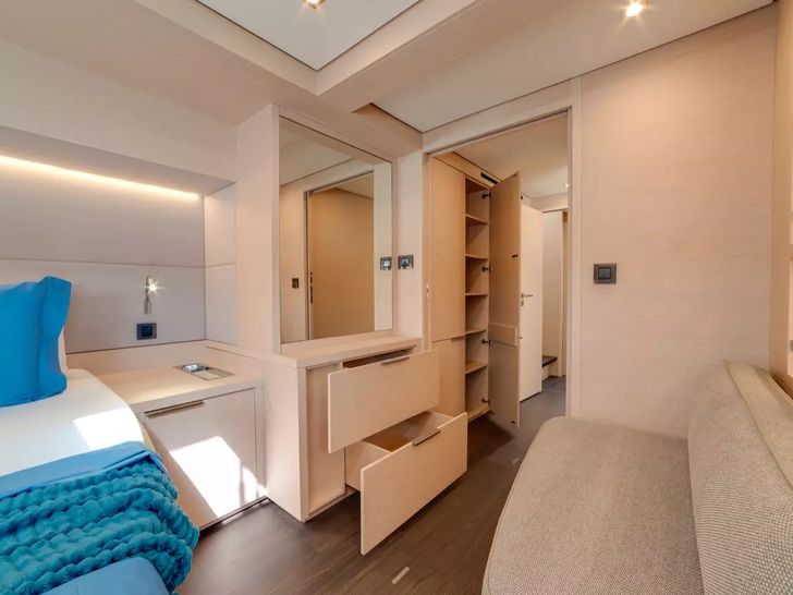 ZERI Lagoon 55 - master cabin seating and closet ZERI Lagoon 55 - master cabin seating and closet