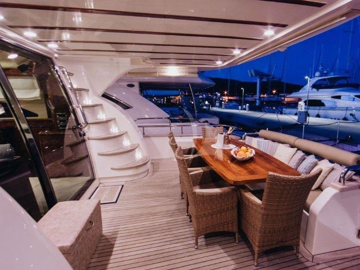 LADY LONA Amer 86 - alfresco dining area with staircase to the flybridge LADY LONA Amer 86 - alfresco dining area with staircase to the flybridge