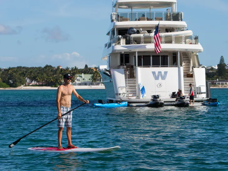 PIPE DREAM - Westport 130,anchored while guest using the SU paddle board