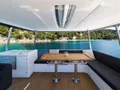CHAMPAGNE PLEASE Lagoon 55 - flybridge dining lounge CHAMPAGNE PLEASE Lagoon 55 - flybridge dining lounge