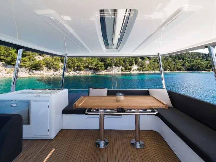 CHAMPAGNE PLEASE Lagoon 55 - flybridge dining lounge CHAMPAGNE PLEASE Lagoon 55 - flybridge dining lounge