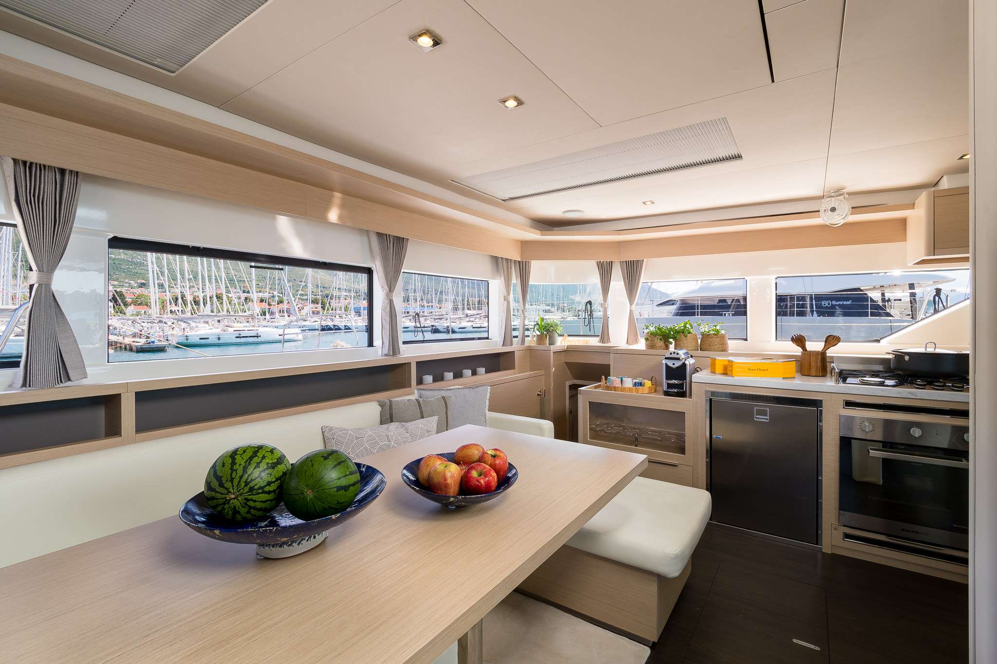 CHAMPAGNE PLEASE Lagoon 55 - saloon dining area and galley