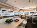 CHAMPAGNE PLEASE Lagoon 55 - saloon dining area and galley CHAMPAGNE PLEASE Lagoon 55 - saloon dining area and galley