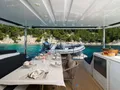 CHAMPAGNE PLEASE Lagoon 55 - main aft deck alfresco dining set up CHAMPAGNE PLEASE Lagoon 55 - main aft deck alfresco dining set up
