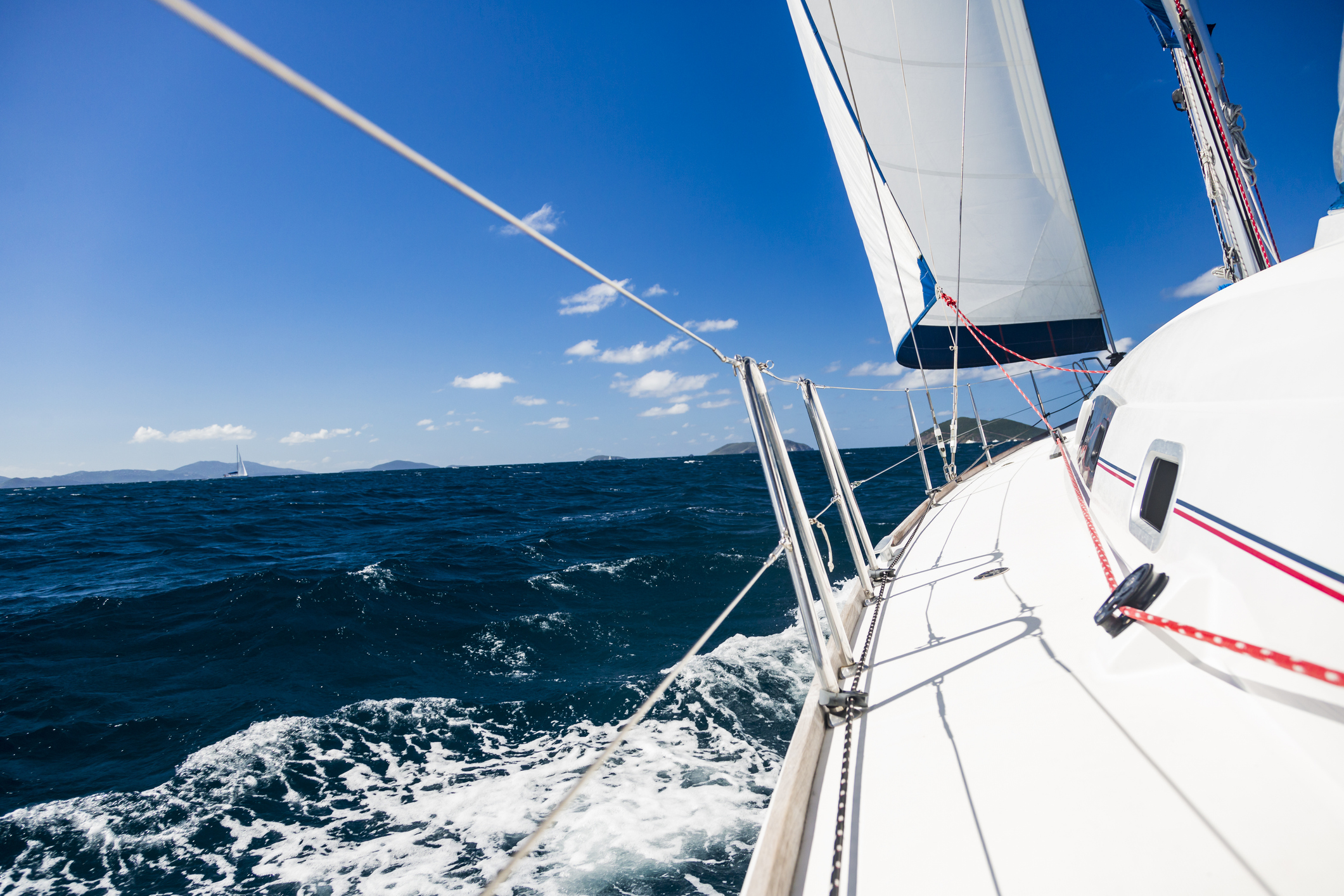 Boat sailing through the blue waters of the caribbean