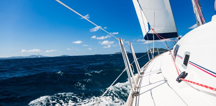 Boat sailing through the blue waters of the caribbean